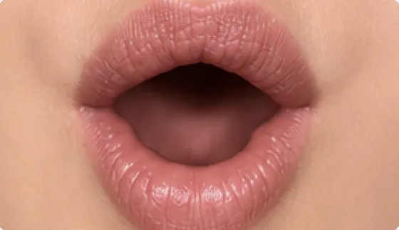 Mouth position for the French vowel [ɔ], as in alors, homme